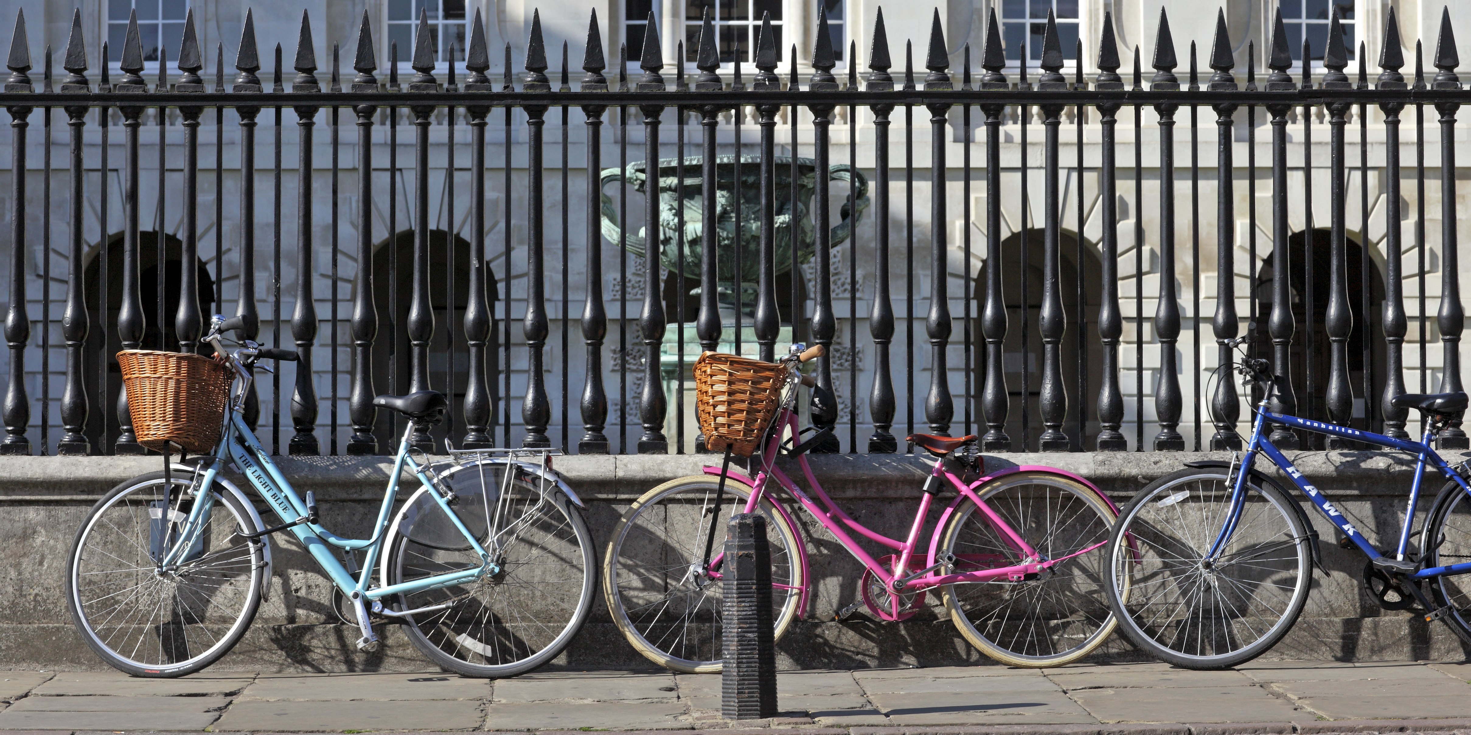 Bikes leaning against a wall