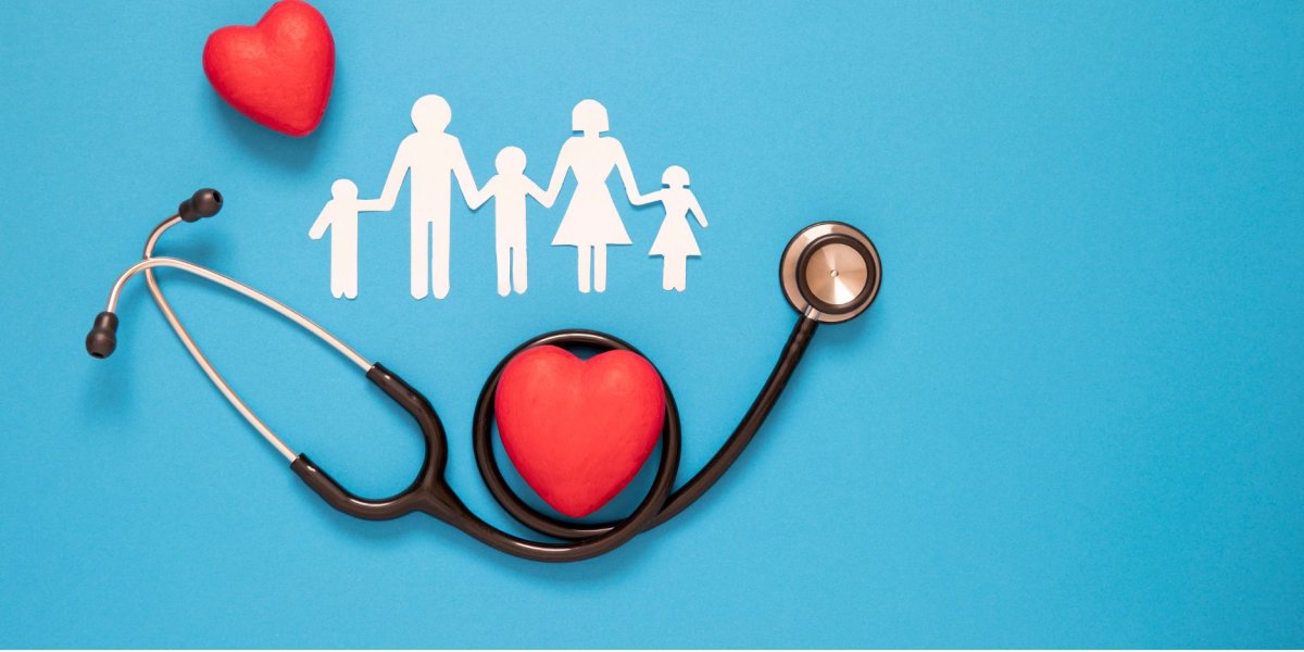 A stethoscope on a plain blue background with circling a love heart and underneath a paper cut out family