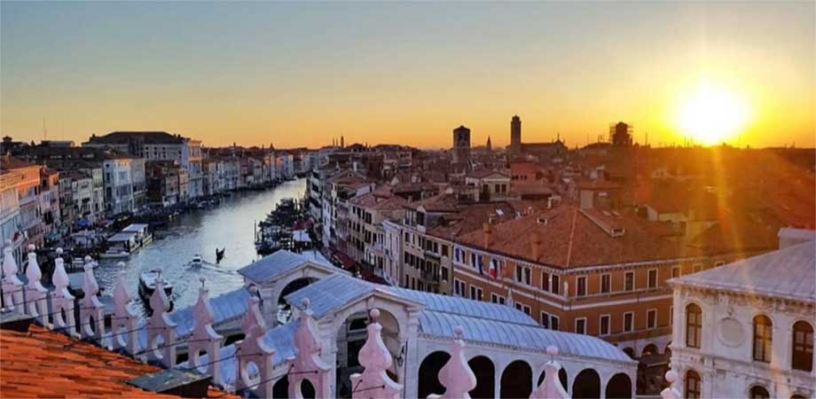 A view of Venice's Grand Canal from above at sunset