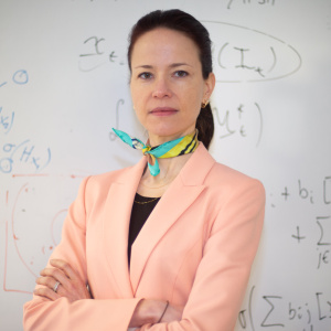 Photograph of Professor Amanda Prorok in a light pink suite