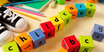 Children's wooden play blocks with the work 'childcare' spelled out.