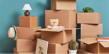 Piles of boxes with household goods and books packed into them.