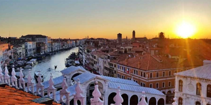 A view of Venice's Grand Canal from above at sunset