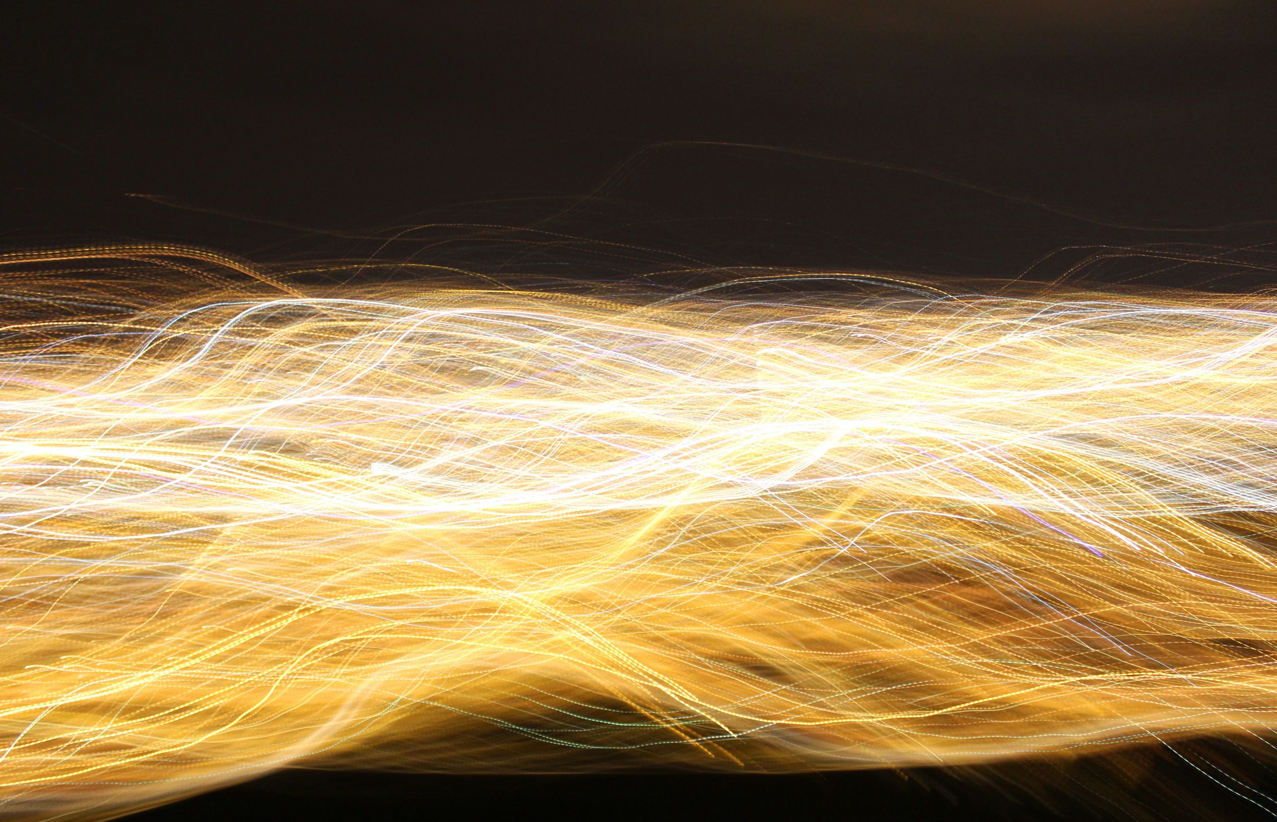 Light waves on black background