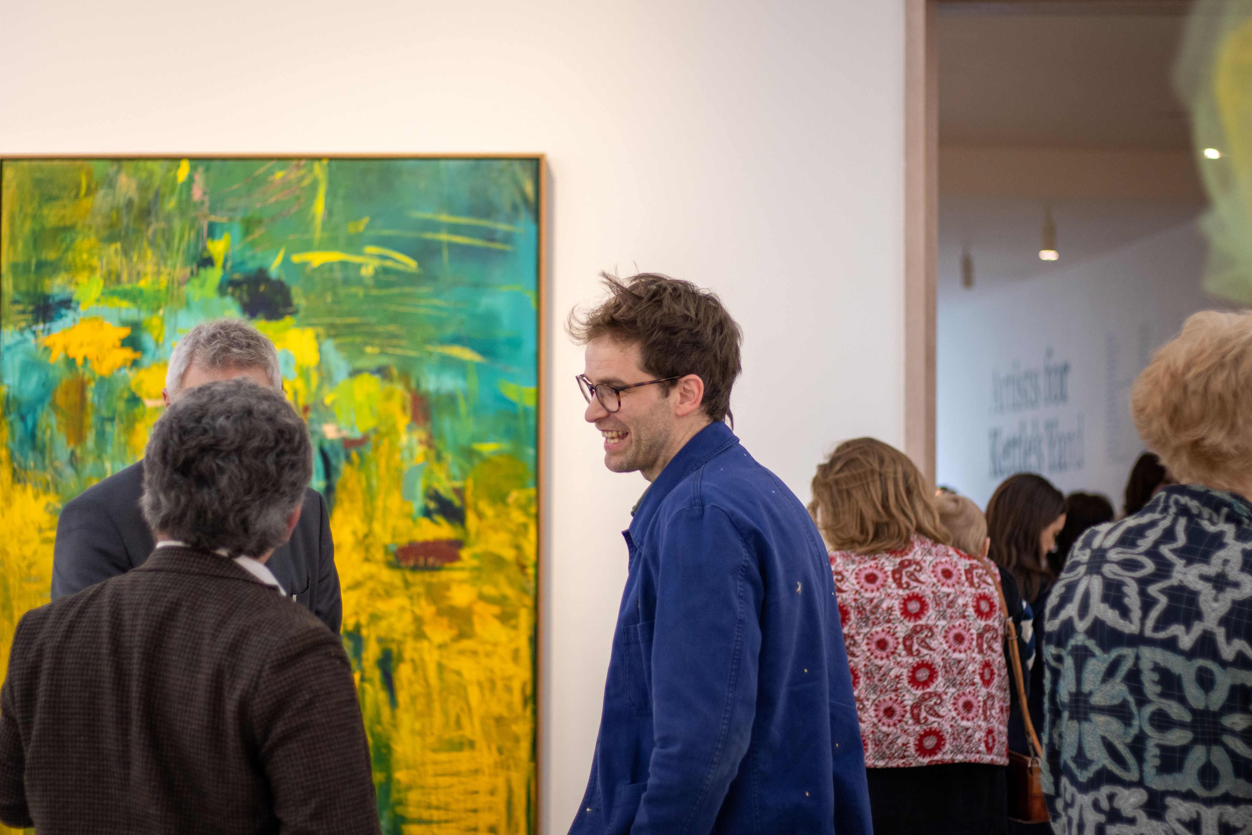 People standing and talking in the Kettle's Yard exhibition space