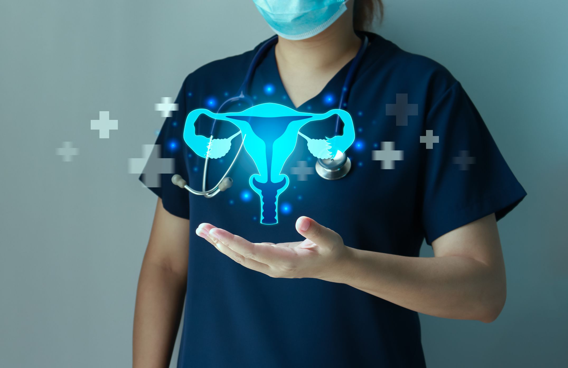 an image showing a healthcare professional behind a holographic representation of uterine anatomy 