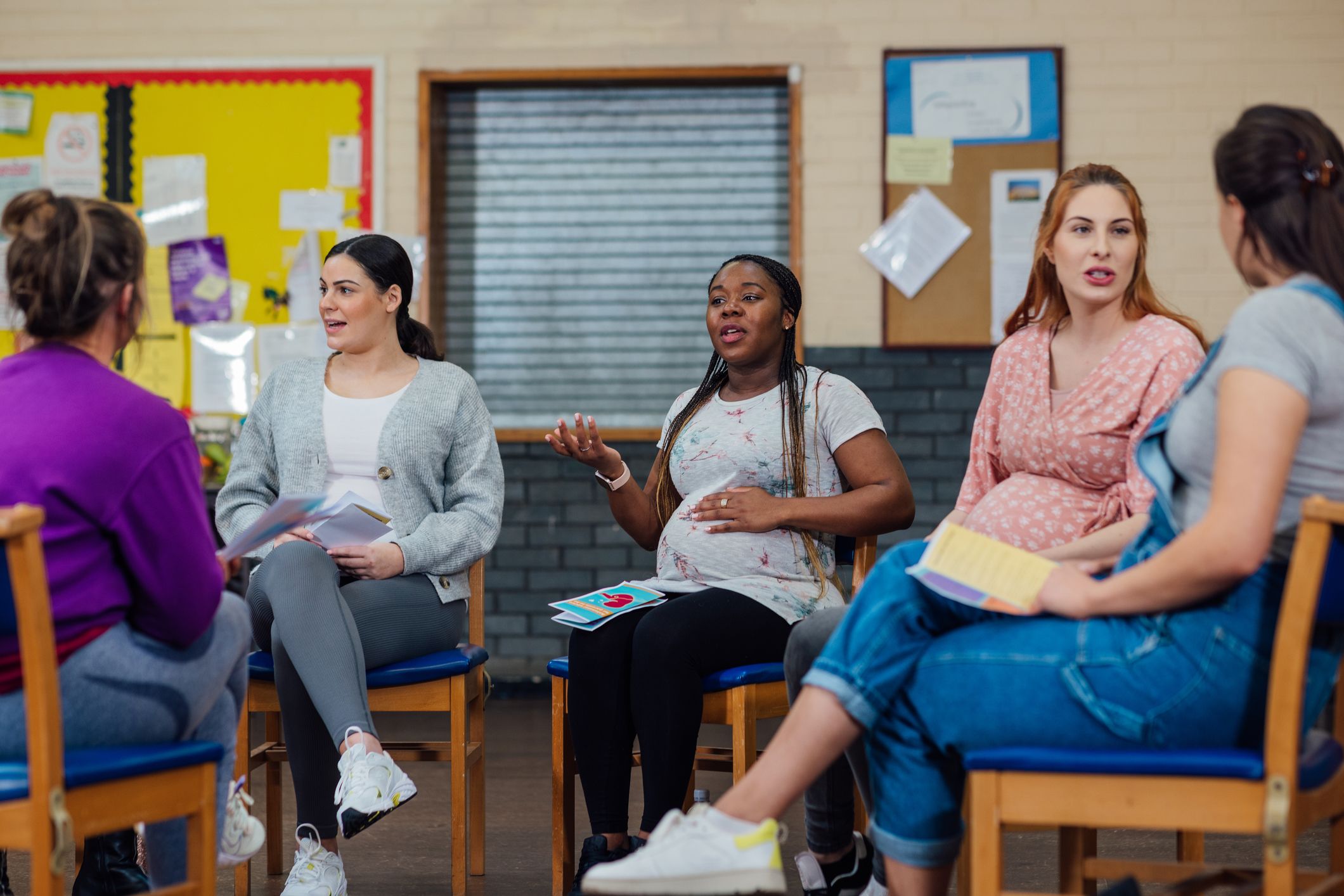 photograph of a number of women sat in a group session