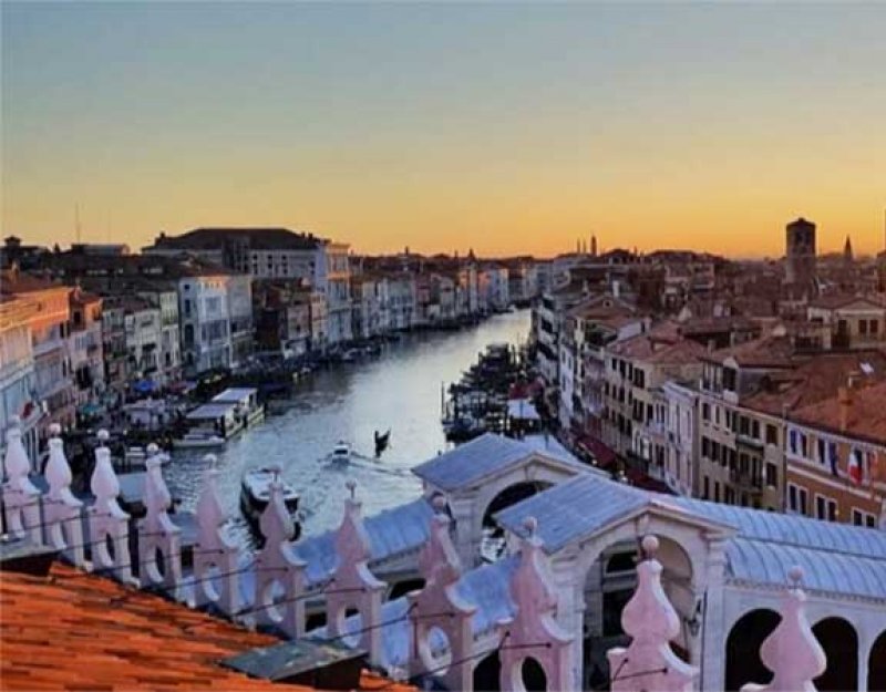A view of Venice's Grand Canal from above at sunset