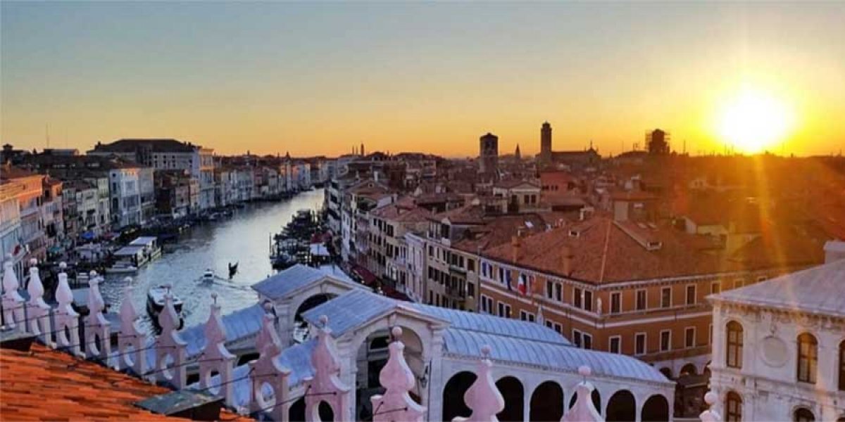 A view of Venice's Grand Canal from above at sunset