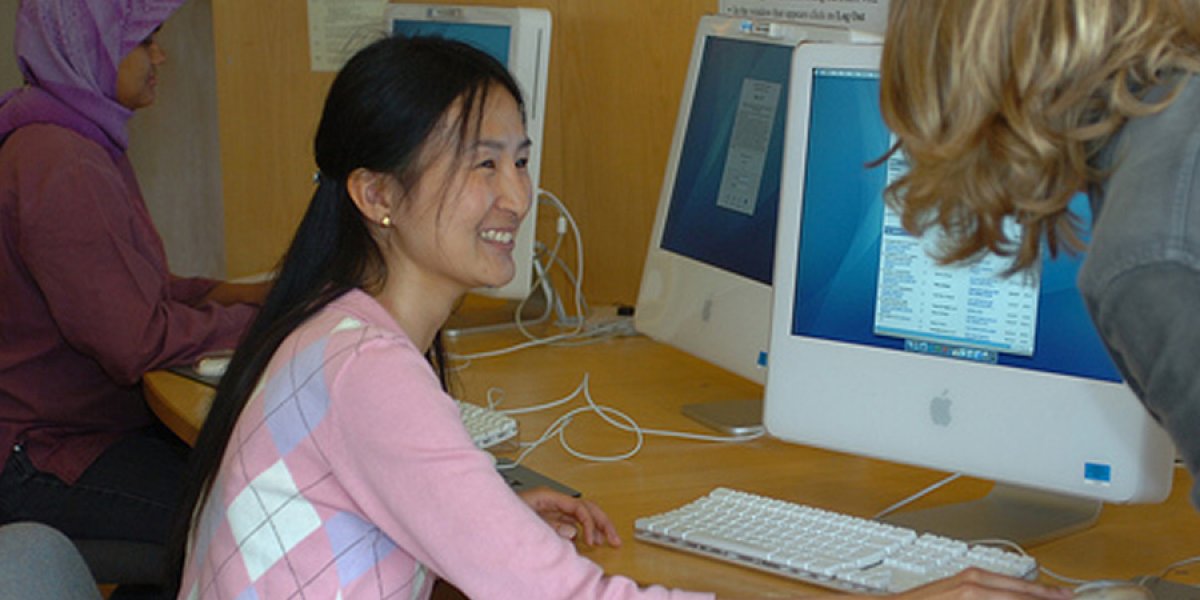 Student learning to use computer equipment